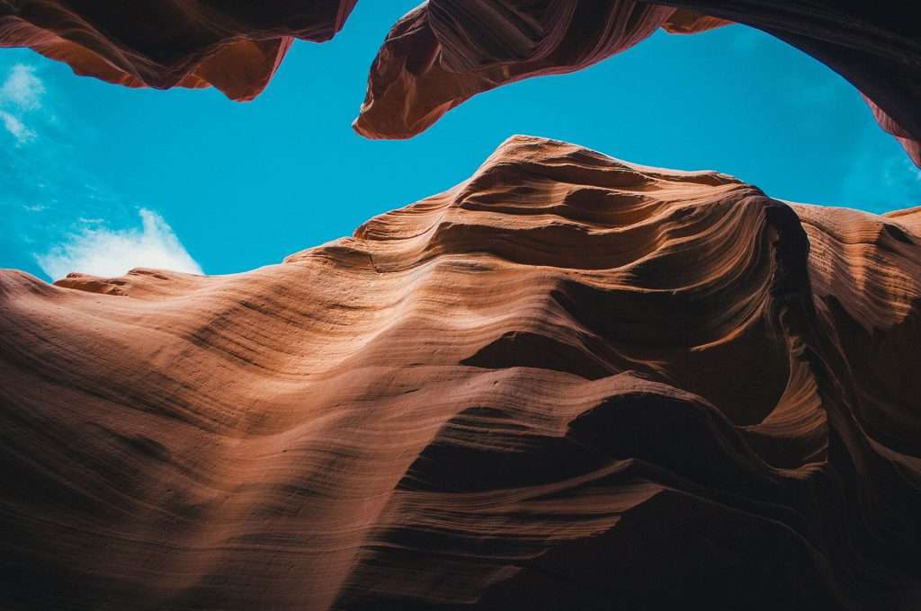 blue sky showing through canyon walls of Antelope Canyon