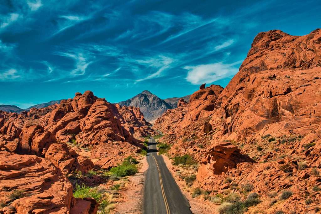 horizon view of street going through mountains in valley of fire